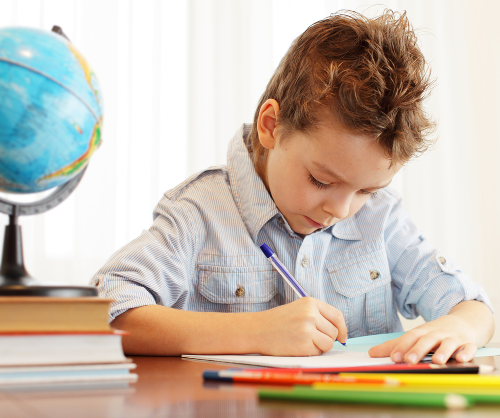 Image of a boy doing homework