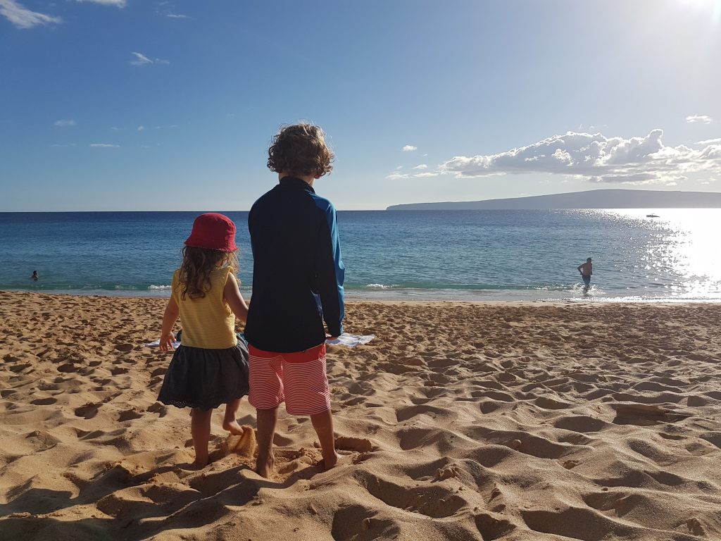Kids looking at ocean in Maui