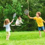 Summer fun - kids playing with dog