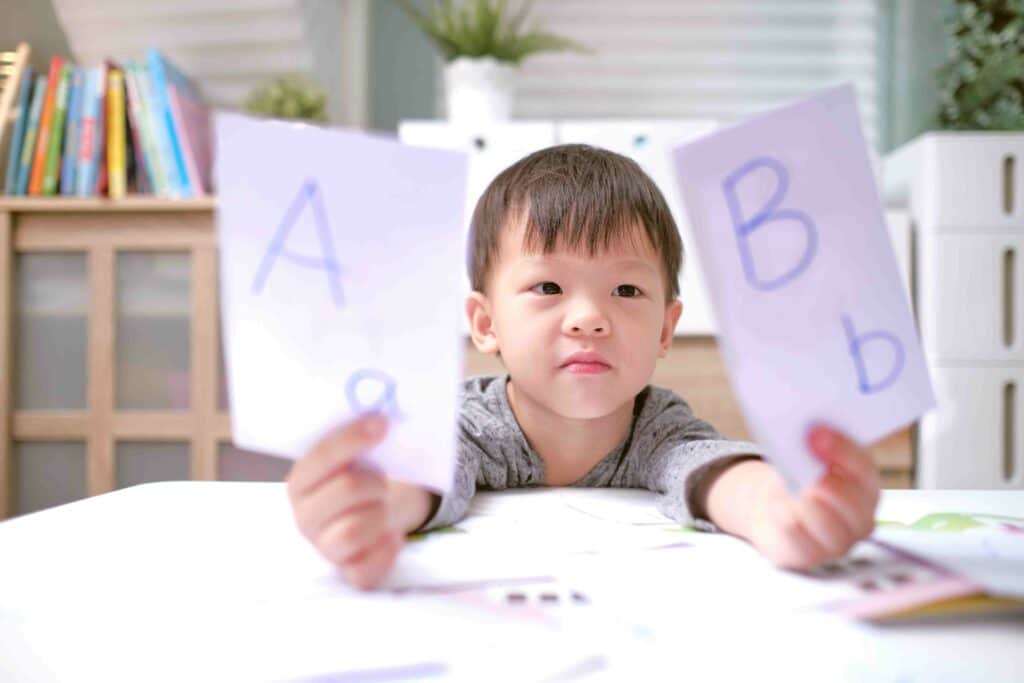 child with flashcards learning