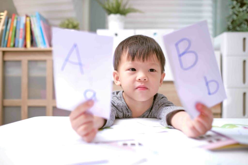 boy reviewing letters for school