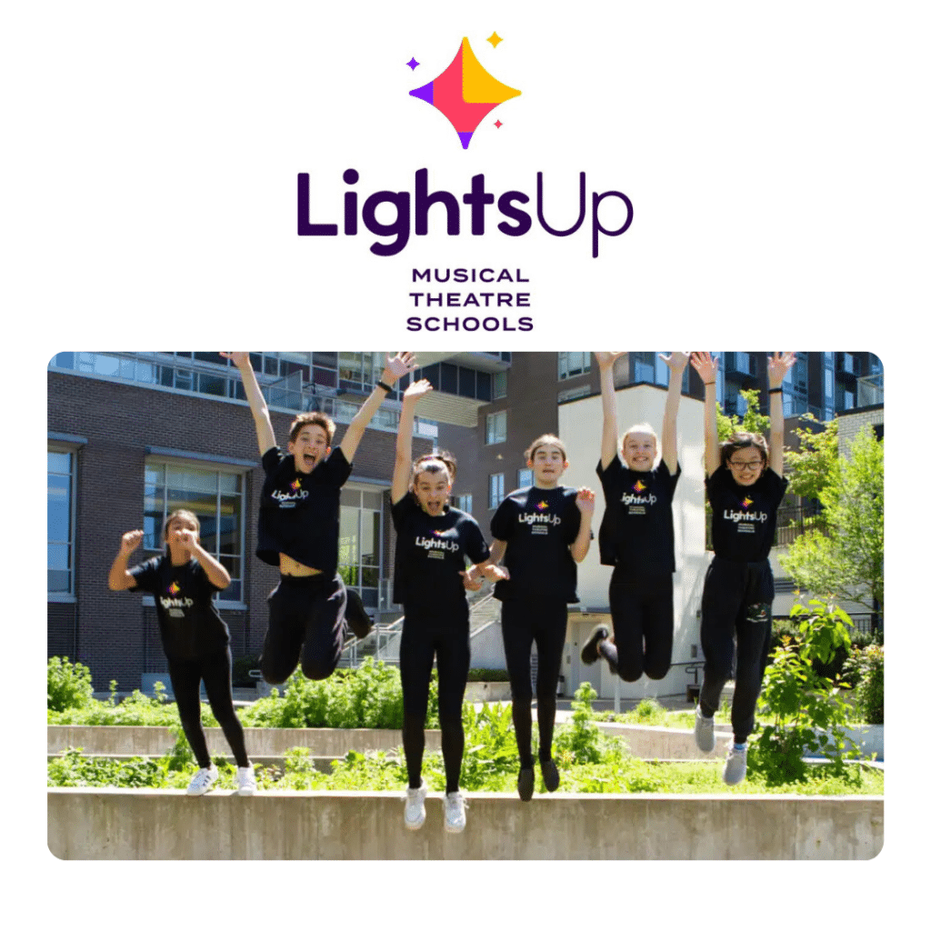 Students jumping up in the air and smiling.