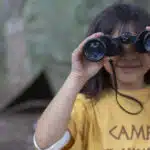 summer-camps girl with binoculars