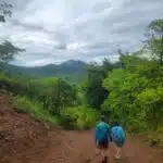 Boy and girl walking on a dirt road in Panama