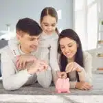 parents teaching child on investing