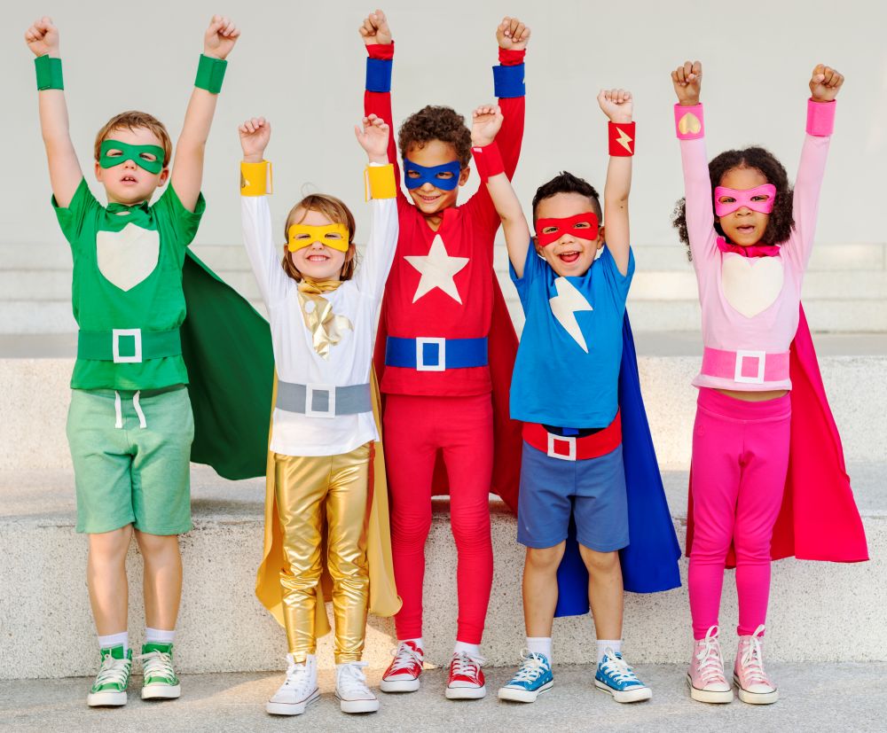 Kids dressed in superhero costumes for a birthday party.