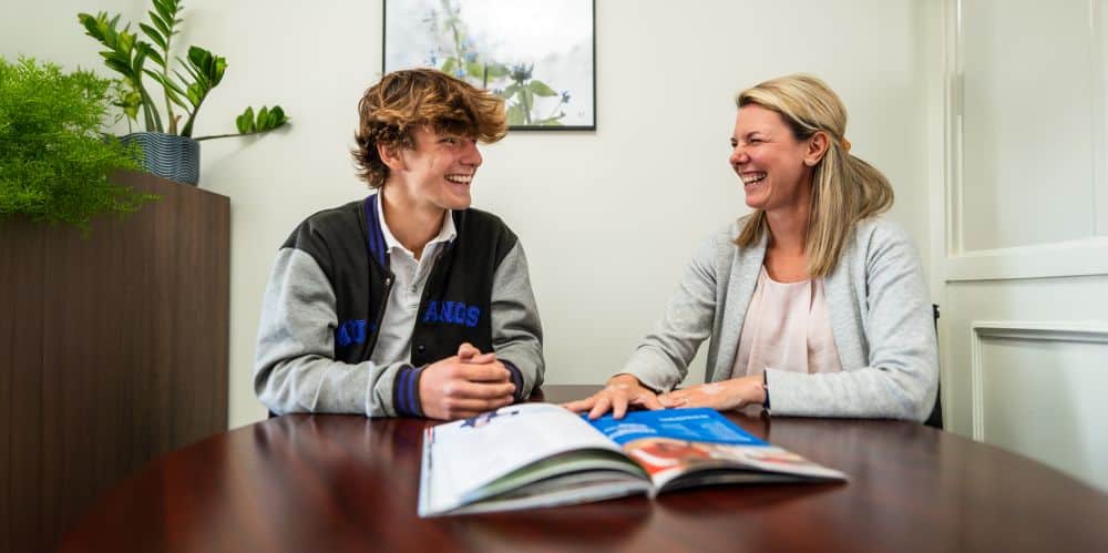 A dyslexic learner sitting and speaking with his counsellor.  