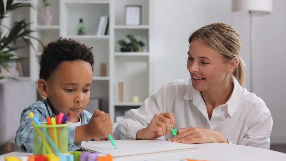 A neurodivergent child with a therapist.