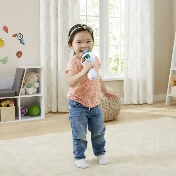 Young girl singing karaoke at a birthday party.