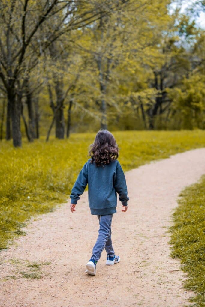 Girl walking down a path.