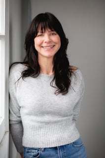 woman standing and smiling