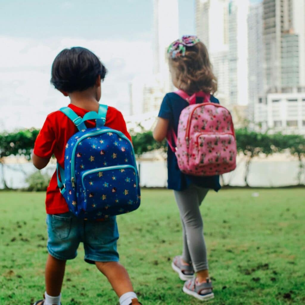 kids walking with backpacks
