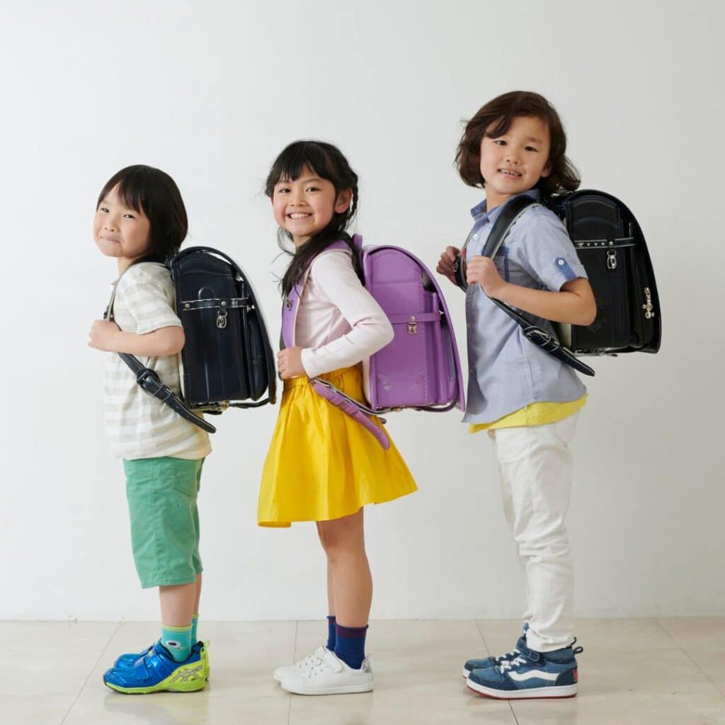 kids carrying backpacks