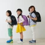 kids carrying backpacks