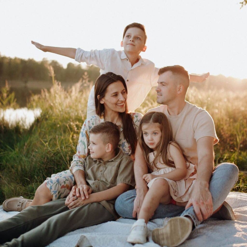 family resting on a trip