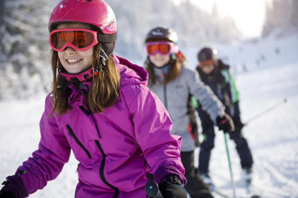 family enjoying snow activities